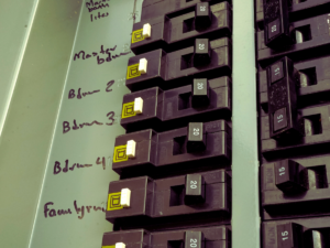 Breaker box with 15 amp breaker and 20 amp breakers 