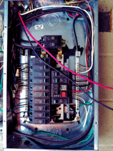 circuit breaker repair being done to fix electrical load balancing