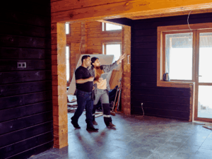 contractor and homeowner planning out electrical layout for home remodel