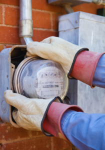 Electrician performing meter can replacement