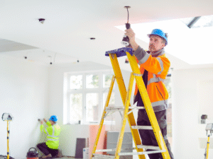 Electricians rewiring house while residents live in house